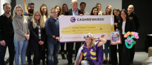 Cashrewards founder presenting a cheque to the Starlight Foundation